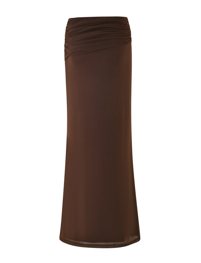 The TIGERMIST ESHA MAXI SKIRT in Chocolate is a knee-length brown skirt with a slightly asymmetrical waistband, shown on a white background.