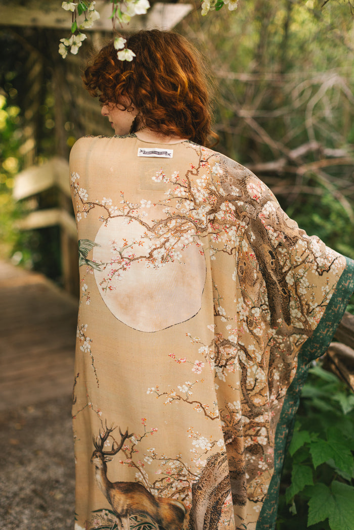 Model wearing Fable Goddess Duster featuring antique Japanese art, cherry and peach blossoms, nightingales, deer, and French block prints - Market of Stars