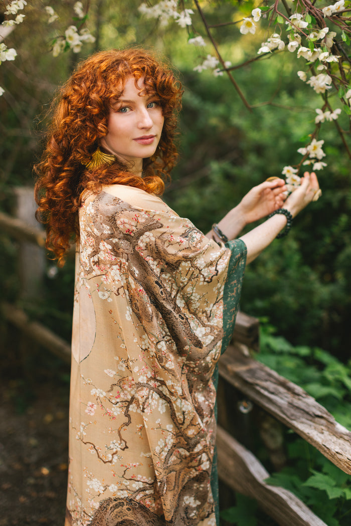Model wearing Fable Goddess Duster featuring antique Japanese art, cherry and peach blossoms, nightingales, deer, and French block prints - Market of Stars