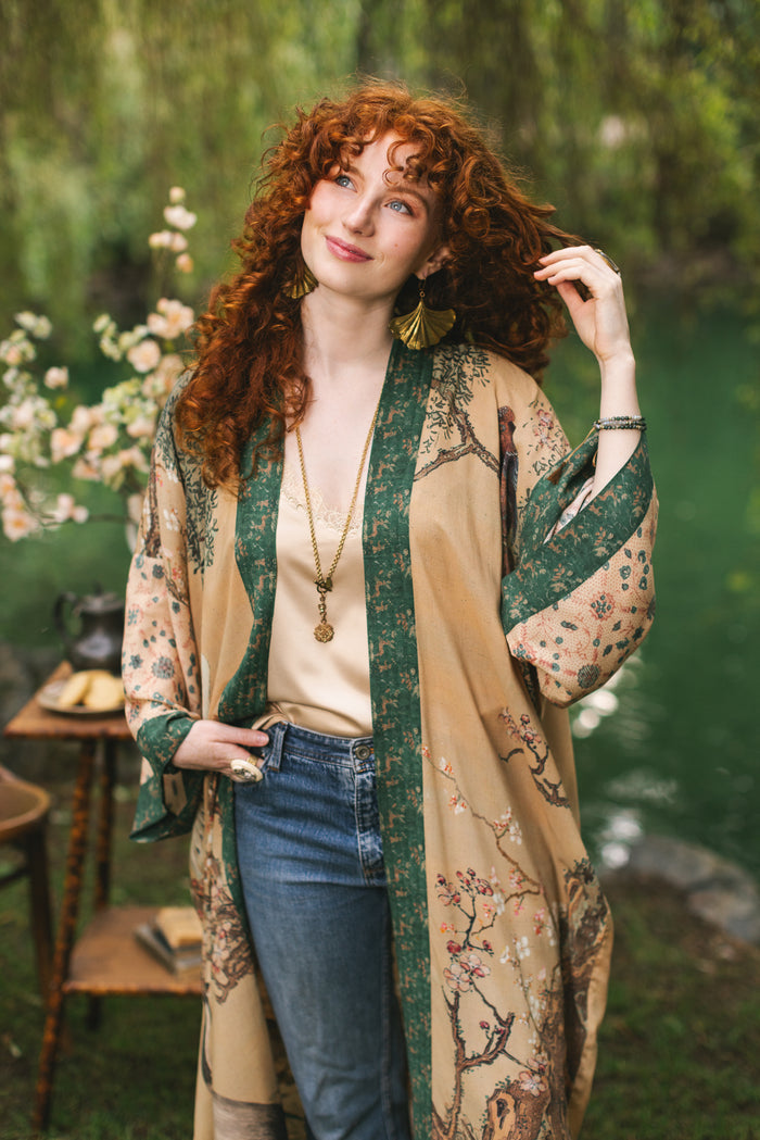 Model wearing Fable Opera Duster featuring antique Japanese art, cherry and peach blossoms, nightingales, deer, and French block prints - Market of Stars