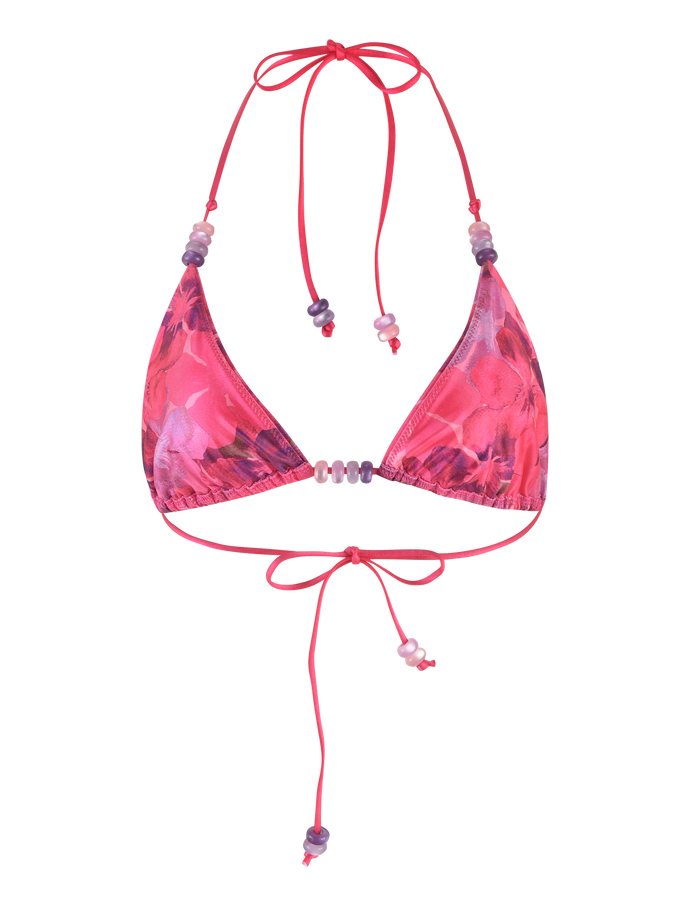 The TIGERMIST FINLEA BIKINI TOP - PINK : HIBISCUS features a pink floral print with purple accents, halter neck, back tie strings, adjustable fit, and small beads on the straps.