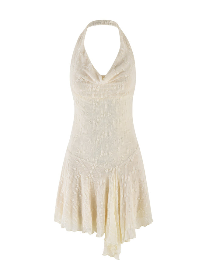 The FIORELLA MINI DRESS by TIGERMIST features a sleeveless cream lace design with a halter neck, draped cowl neckline, fitted bodice, and asymmetrical flowy skirt, finished with a subtle textured pattern for an elegant touch.