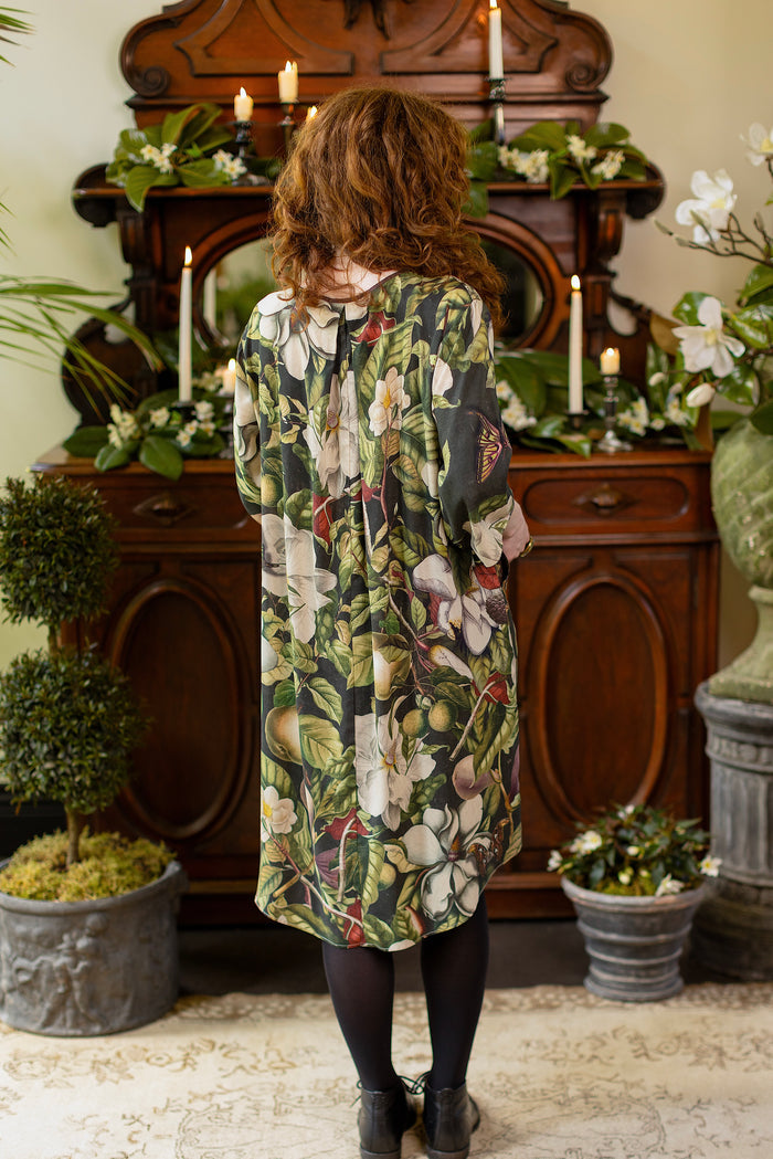 Model wearing Fleur De Lune Artist Dress featuring vintage magnolia lithographs, delicate moth etchings and bumblebee detail - inspired by the French chemise - Market of Stars
