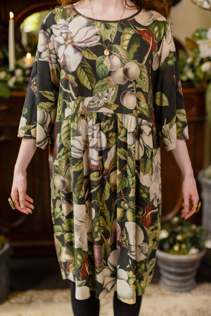 Model wearing Fleur De Lune Artist Dress featuring vintage magnolia lithographs, delicate moth etchings and bumblebee detail - inspired by the French chemise - Market of Stars