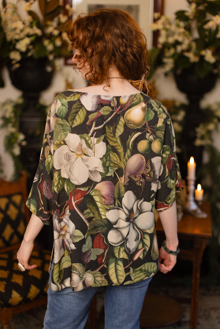 Model wearing the Fleur De Lune Luxe Tee with wide scoop neck and soft bamboo-based viscose, featuring vintage magnolia lithographs, delicate moth etchings, and bumblebee trim - Market of Stars
