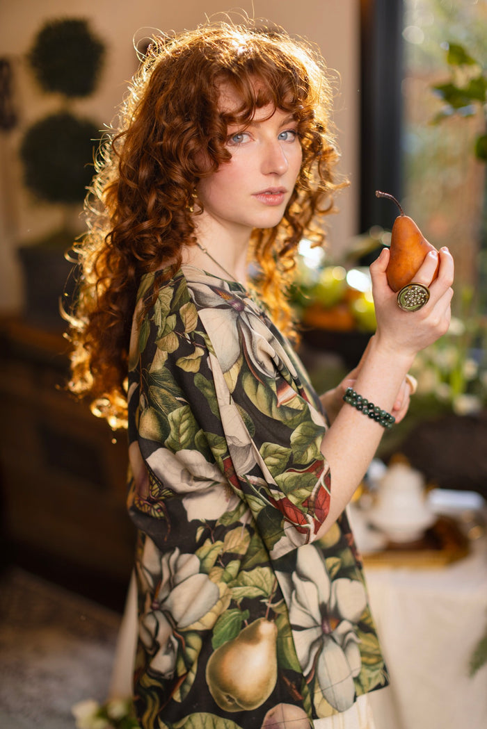 Model wearing the Fleur De Lune Luxe Tee with wide scoop neck and soft bamboo-based viscose, featuring vintage magnolia lithographs, delicate moth etchings, and bumblebee trim - Market of Stars
