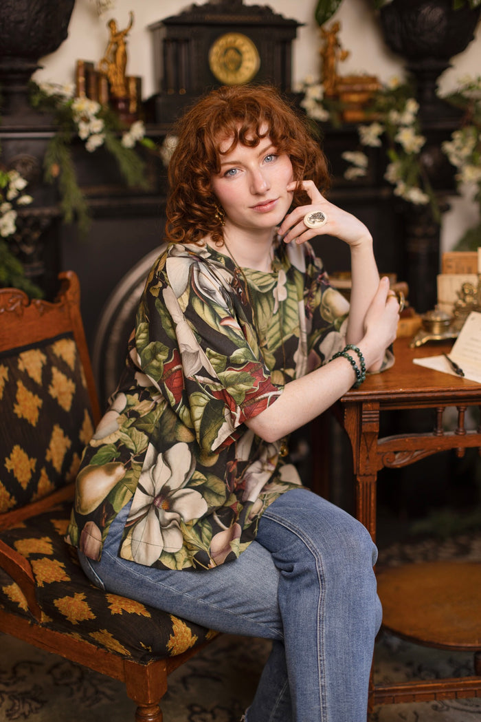 Model wearing the Fleur De Lune Luxe Tee with wide scoop neck and soft bamboo-based viscose, featuring vintage magnolia lithographs, delicate moth etchings, and bumblebee trim - Market of Stars