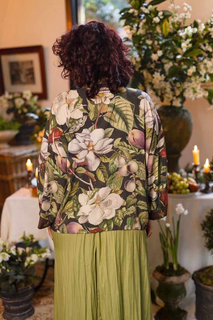 Model wearing a cropped kimono duster featuring vintage magnolia lithographs, delicate moth etchings, and charming bumblebee trim - Market of Stars