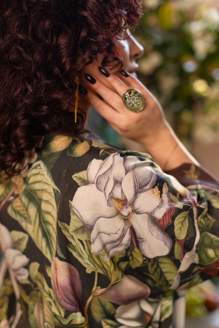 Model wearing a cropped kimono duster featuring vintage magnolia lithographs, delicate moth etchings, and charming bumblebee trim - Market of Stars
