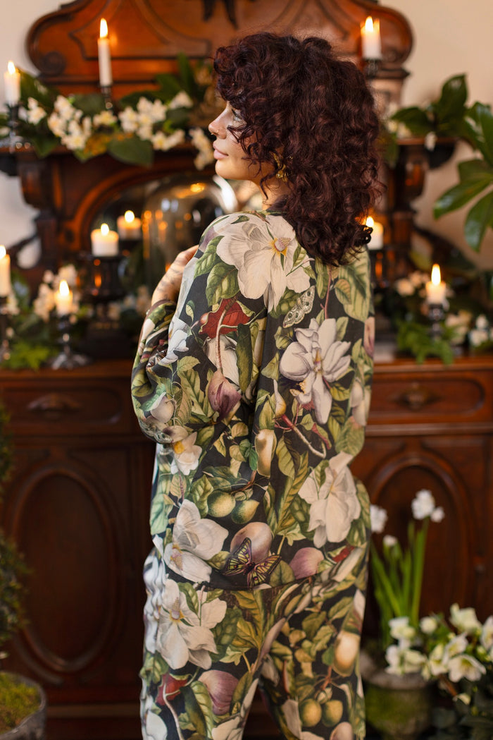 Model wearing a cropped kimono duster featuring vintage magnolia lithographs, delicate moth etchings, and charming bumblebee trim - Market of Stars