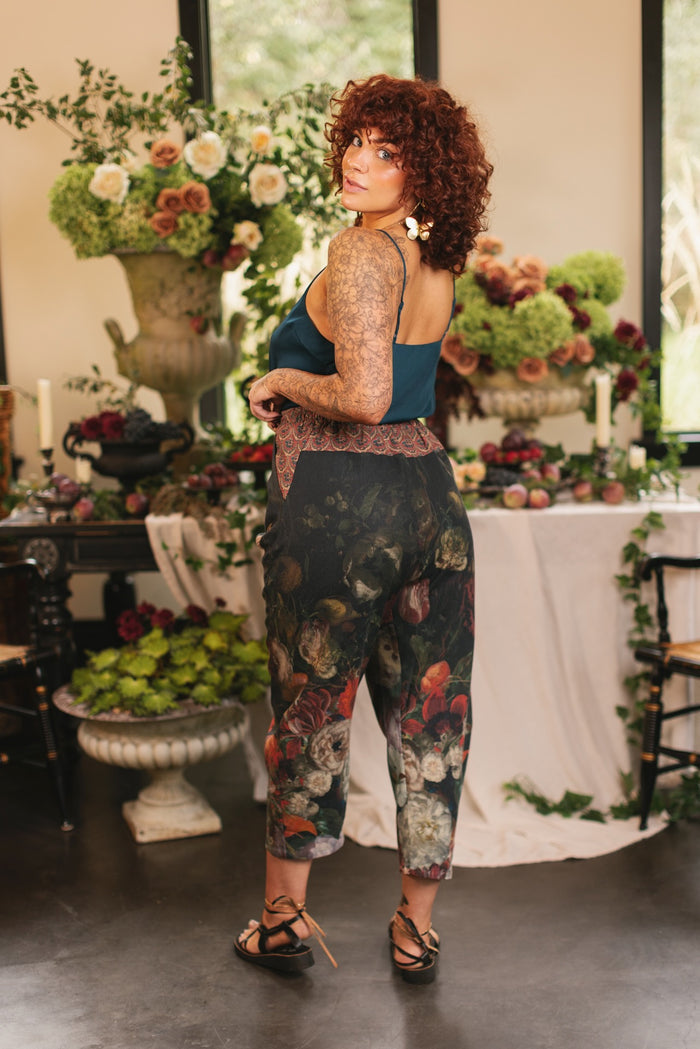 Model wearing the Folklore Artist Pant featuring the Bird-of-Peace embroidery and unfinished William Morris textile designs—artful linen blend pants by Market of Stars.