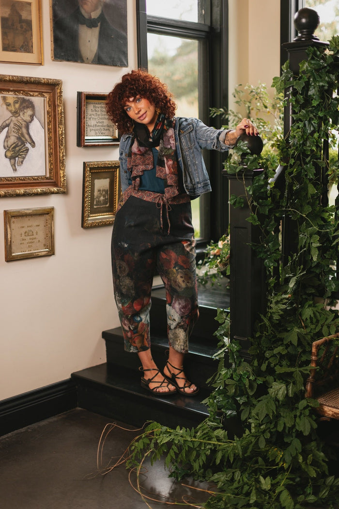 Model wearing the Folklore Artist Pant featuring the Bird-of-Peace embroidery and unfinished William Morris textile designs—artful linen blend pants by Market of Stars.