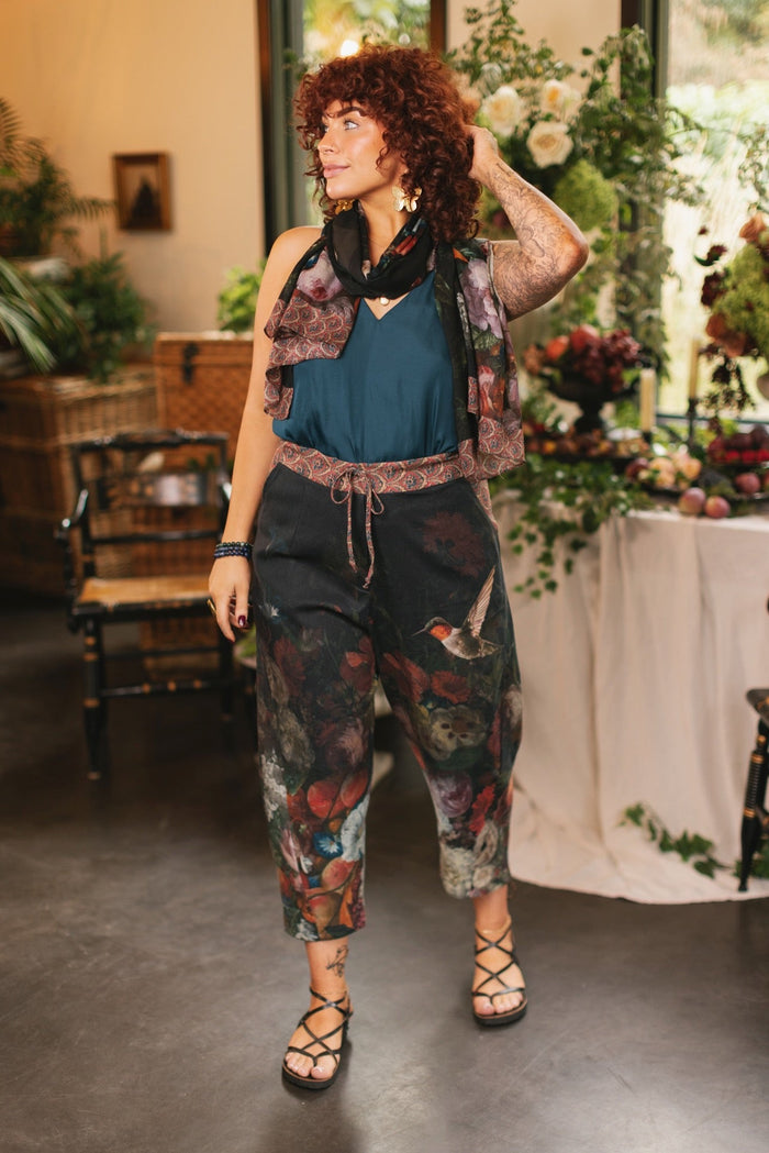Model wearing the Folklore Artist Pant featuring the Bird-of-Peace embroidery and unfinished William Morris textile designs—artful linen blend pants by Market of Stars.