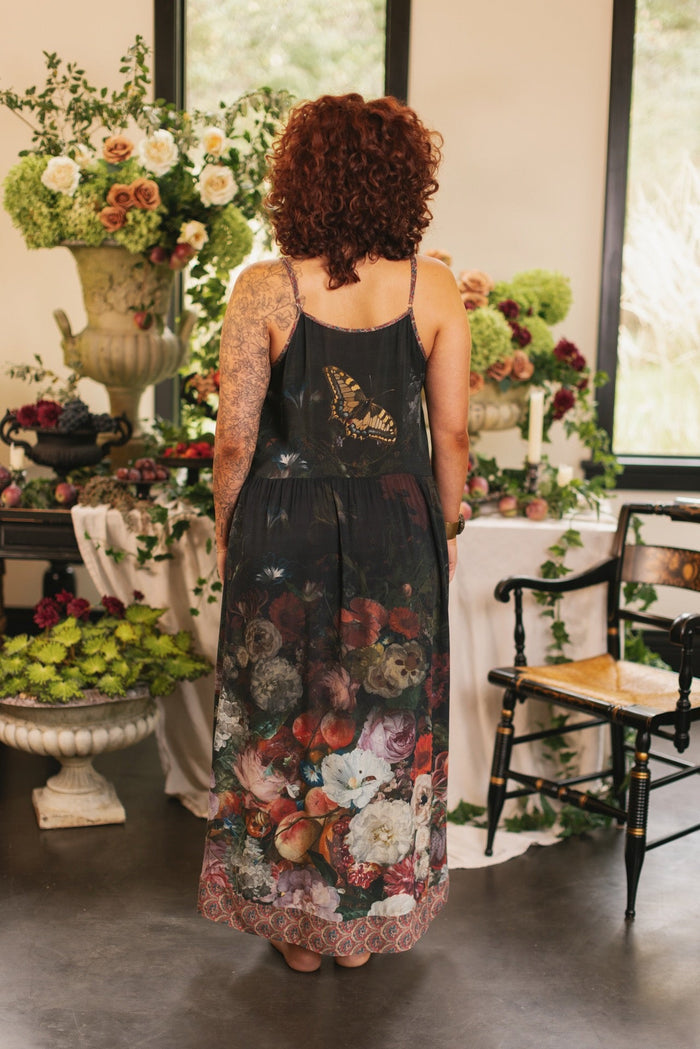 Model wearing Flight of Fancy Bohéme Slip Dress featuring hummingbirds and a vibrant floral bouquet inspired by 1700s still-life paintings by Rachel Ruysch – Market of Stars.