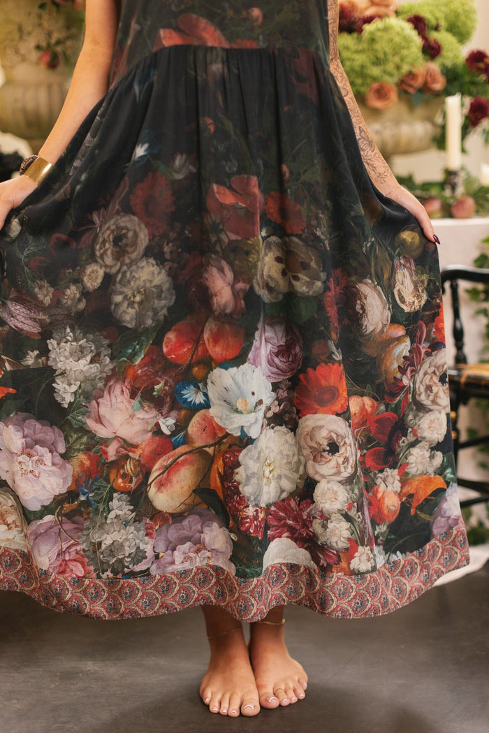 Model wearing Flight of Fancy Bohéme Slip Dress featuring hummingbirds and a vibrant floral bouquet inspired by 1700s still-life paintings by Rachel Ruysch – Market of Stars.