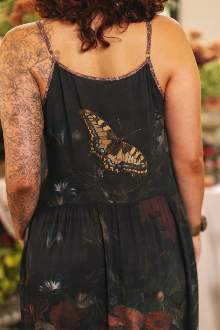 Model wearing Flight of Fancy Bohéme Slip Dress featuring hummingbirds and a vibrant floral bouquet inspired by 1700s still-life paintings by Rachel Ruysch – Market of Stars.