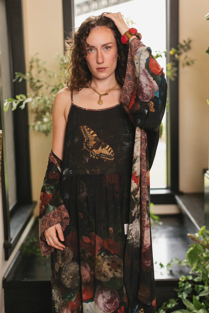 Model wearing Flight of Fancy Bohéme Slip Dress featuring hummingbirds and a vibrant floral bouquet inspired by 1700s still-life paintings by Rachel Ruysch – Market of Stars.