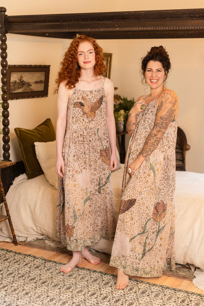 Model wearing Folklore Boheme slip dress featuring Bird-of-Peace embroidery and unfinished William Morris artwork in earthy romantic tones – Market of Stars.