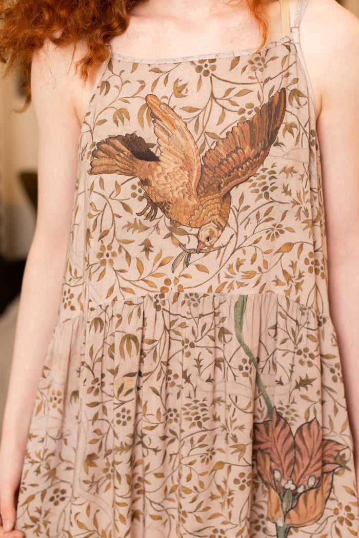 Model wearing Folklore Boheme slip dress featuring Bird-of-Peace embroidery and unfinished William Morris artwork in earthy romantic tones – Market of Stars.