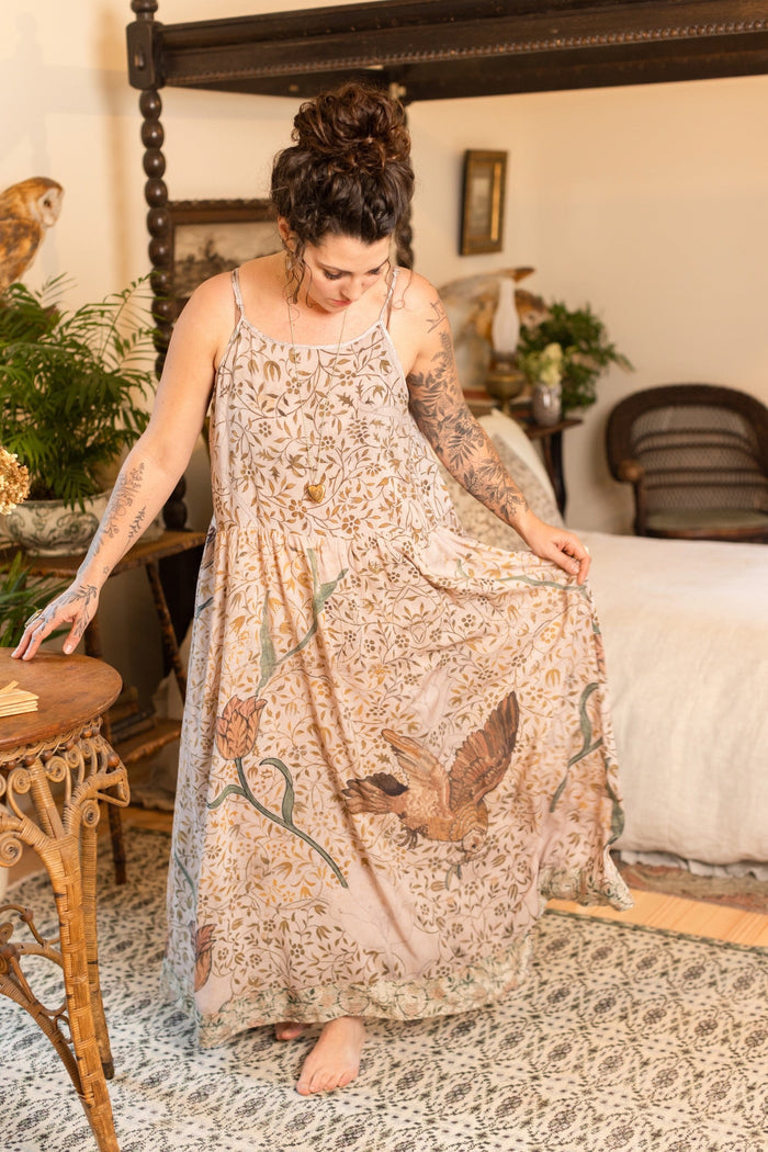 Model wearing Folklore Boheme slip dress featuring Bird-of-Peace embroidery and unfinished William Morris artwork in earthy romantic tones – Market of Stars.