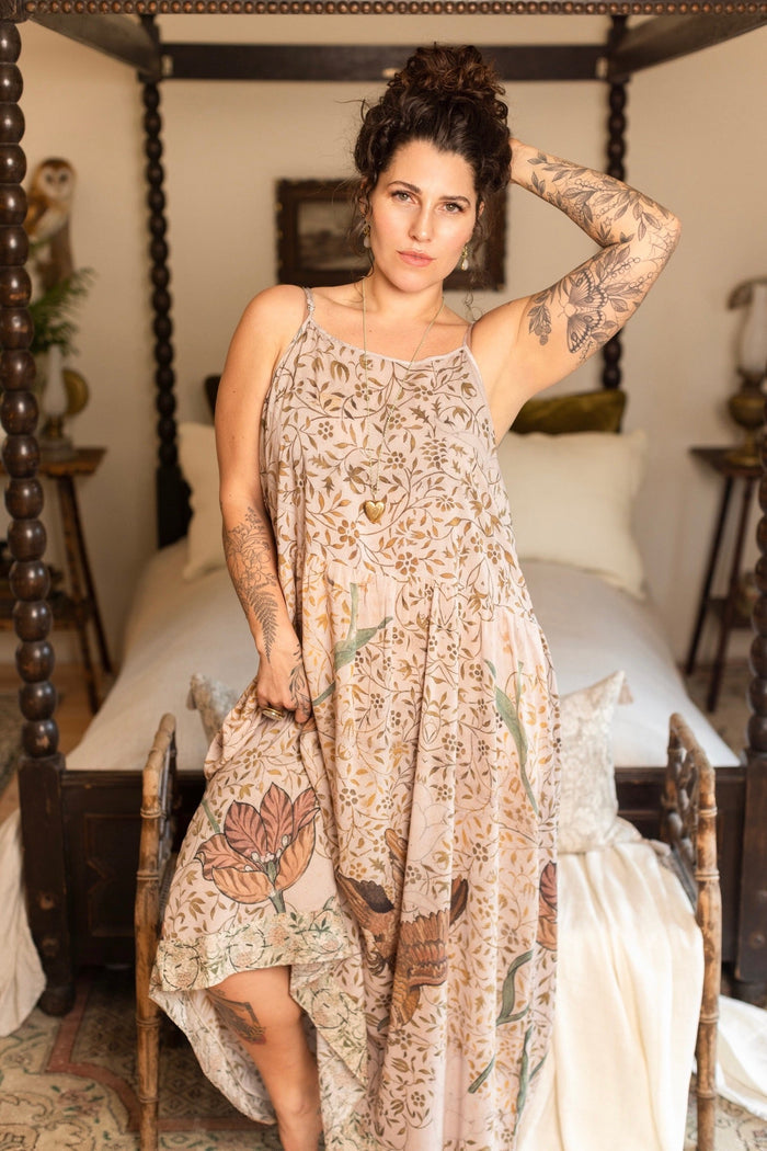 Model wearing Folklore Boheme slip dress featuring Bird-of-Peace embroidery and unfinished William Morris artwork in earthy romantic tones – Market of Stars.