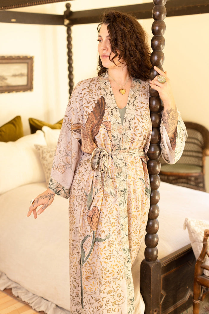 Model wearing opera-length kimono featuring the embroidered Bird-of-Peace by Kim Donohoe and unfinished William Morris panels celebrating artistic process – Market of Stars.