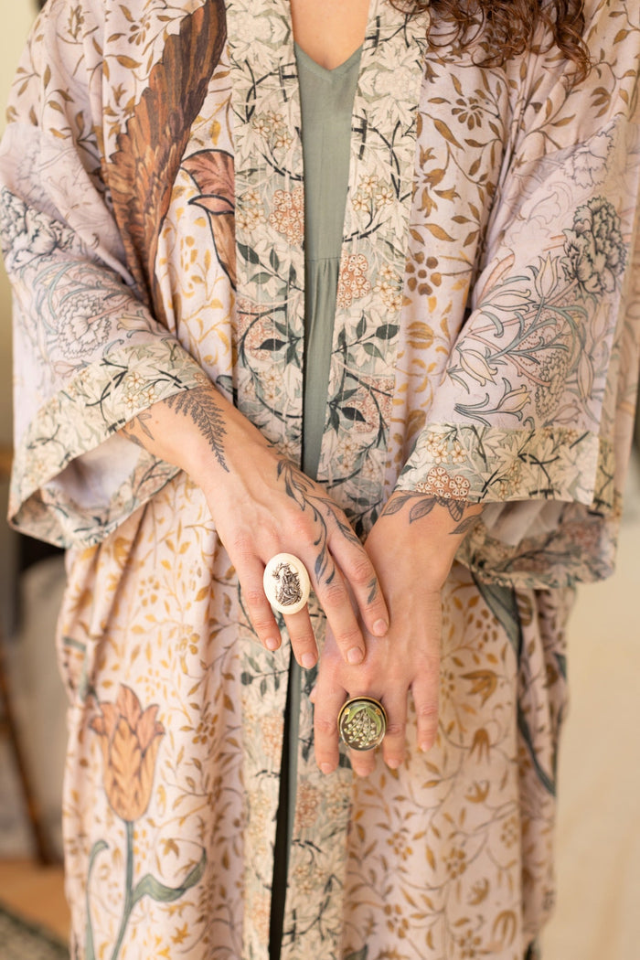 Model wearing opera-length kimono featuring the embroidered Bird-of-Peace by Kim Donohoe and unfinished William Morris panels celebrating artistic process – Market of Stars.