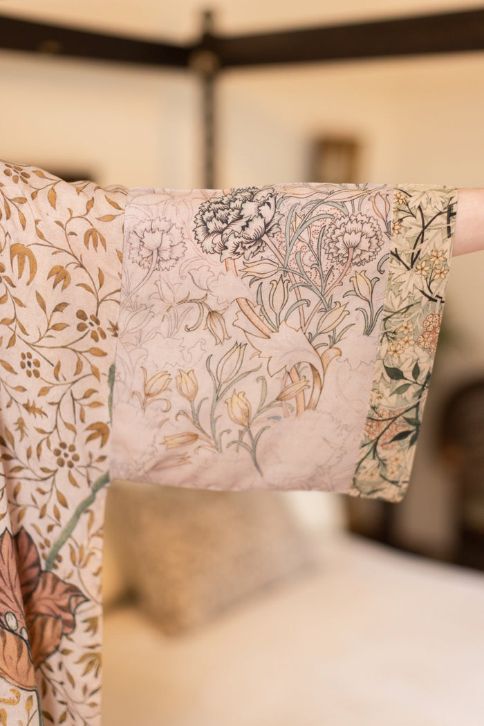 Model wearing opera-length kimono featuring the embroidered Bird-of-Peace by Kim Donohoe and unfinished William Morris panels celebrating artistic process – Market of Stars.