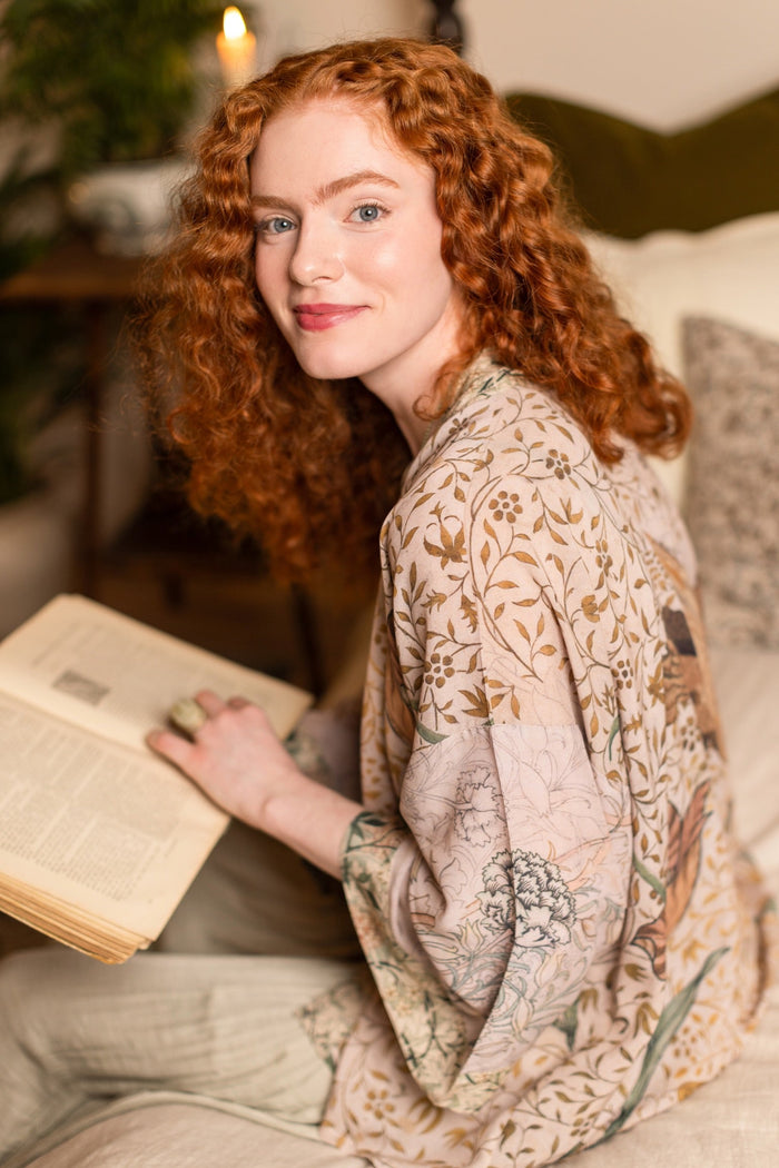 Model wearing full-length Folklore opera duster featuring Bird-of-Peace embroidery and unfinished William Morris textile panels in soft earthy tones – Market of Stars.