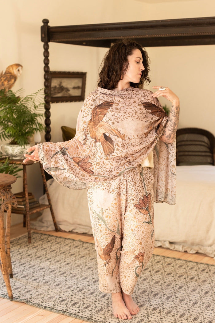 Model wearing soft bamboo viscose scarf featuring embroidered Bird-of-Peace and unfinished William Morris artwork inspired by the Arts and Crafts movement – Market of Stars.