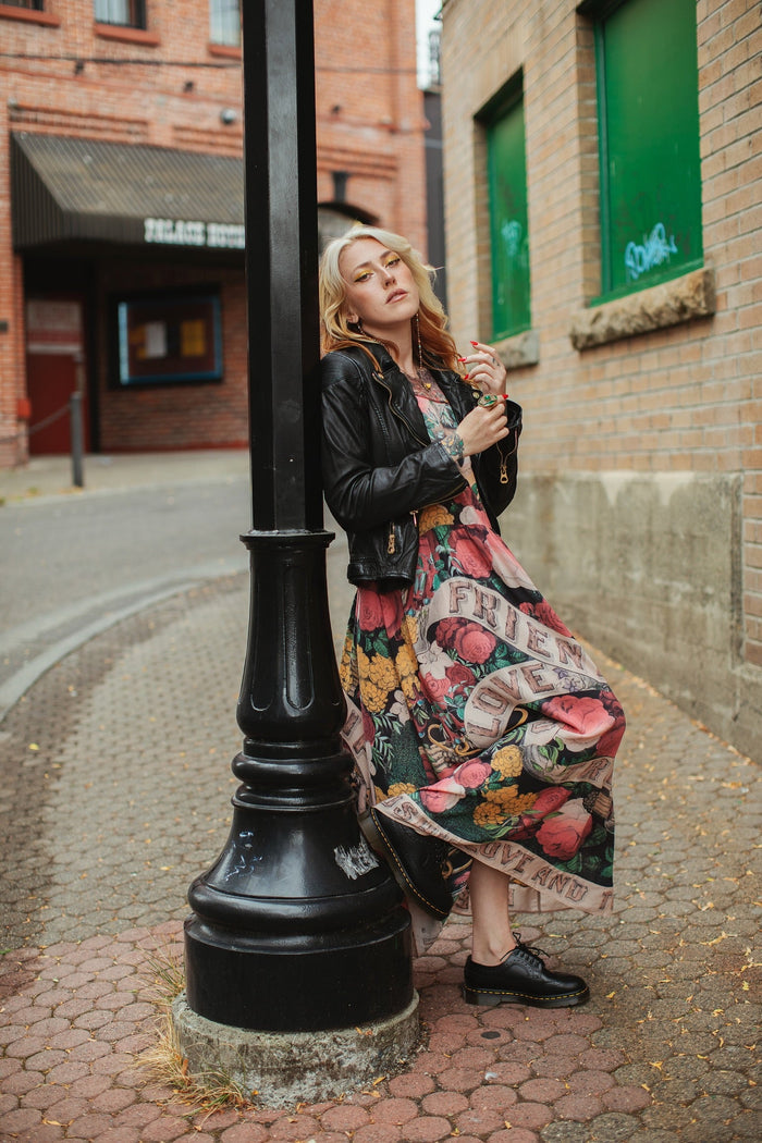 Model wearing reversible bamboo viscose slip dress featuring vintage symbols of friendship, love, and truth with pink and rose palette – Market of Stars.