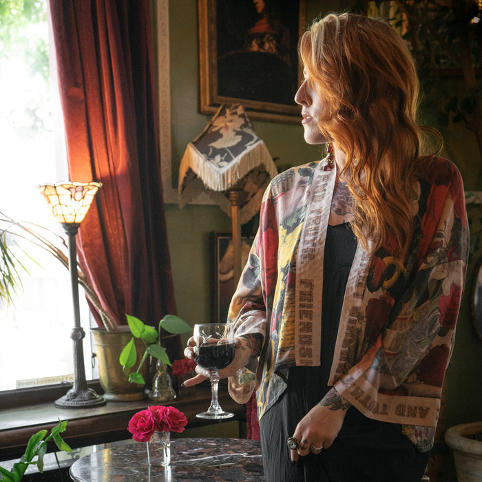 Model wearing our cropped kimono featuring historic symbols of friendship, love, and truth with archive-inspired wood-grain trim and romantic vintage details – Market of Stars.