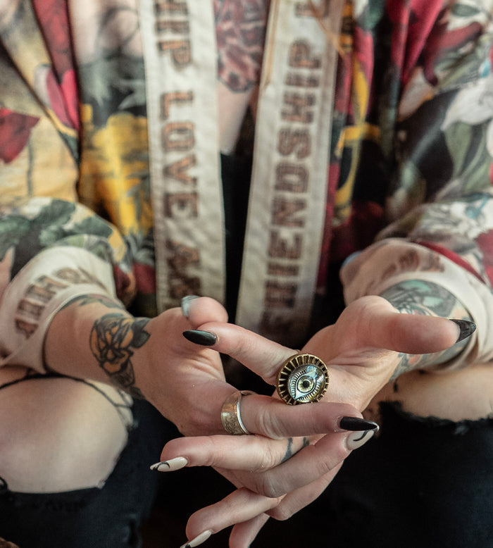 Model wearing our cropped kimono featuring historic symbols of friendship, love, and truth with archive-inspired wood-grain trim and romantic vintage details – Market of Stars.