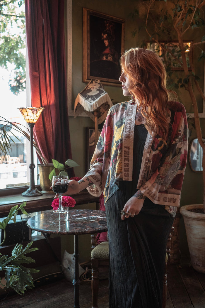 Model wearing our cropped kimono featuring historic symbols of friendship, love, and truth with archive-inspired wood-grain trim and romantic vintage details – Market of Stars.