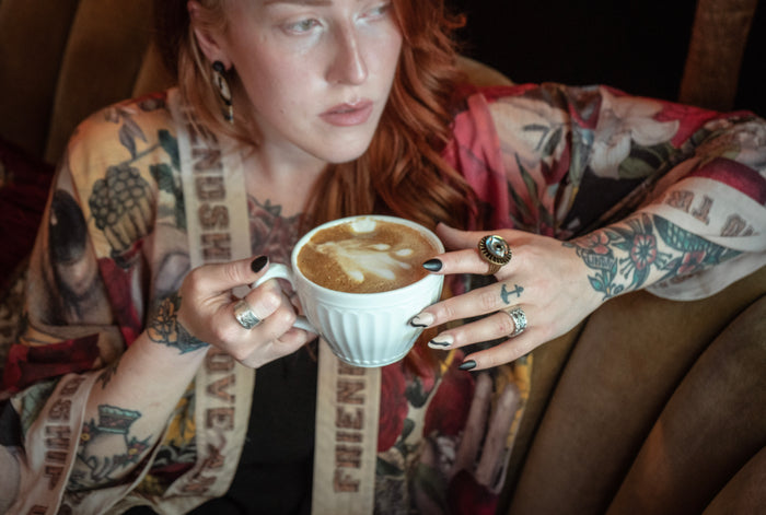 Model wearing our cropped kimono featuring historic symbols of friendship, love, and truth with archive-inspired wood-grain trim and romantic vintage details – Market of Stars.