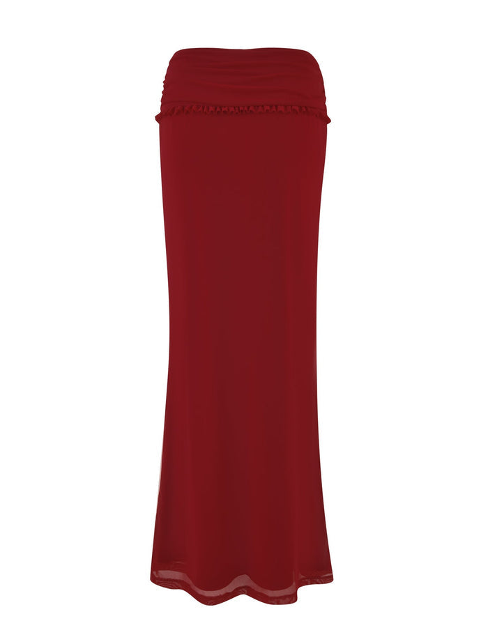 The GINNY MAXI SKIRT - RED : CHERRY RED by TIGERMIST is a long, maxi-length piece featuring a ruched waistband and lightweight, flowing, stretchy fabric. Its simple, elegant design and smooth texture make it a versatile addition to any wardrobe.