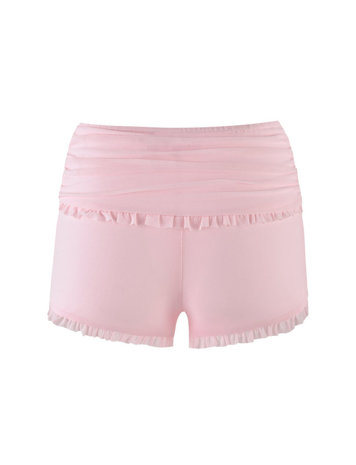 The GINNY SHORT - PINK: BABY PINK from TIGERMIST are a pair of soft baby pink dance shorts with a high waist, featuring delicate ruffles along the waistband and leg openings. Made from high-stretch fabric, they offer comfort suitable for both dance or casual wear. The bodycon silhouette adds a flattering touch. The shorts are showcased against a plain white background.