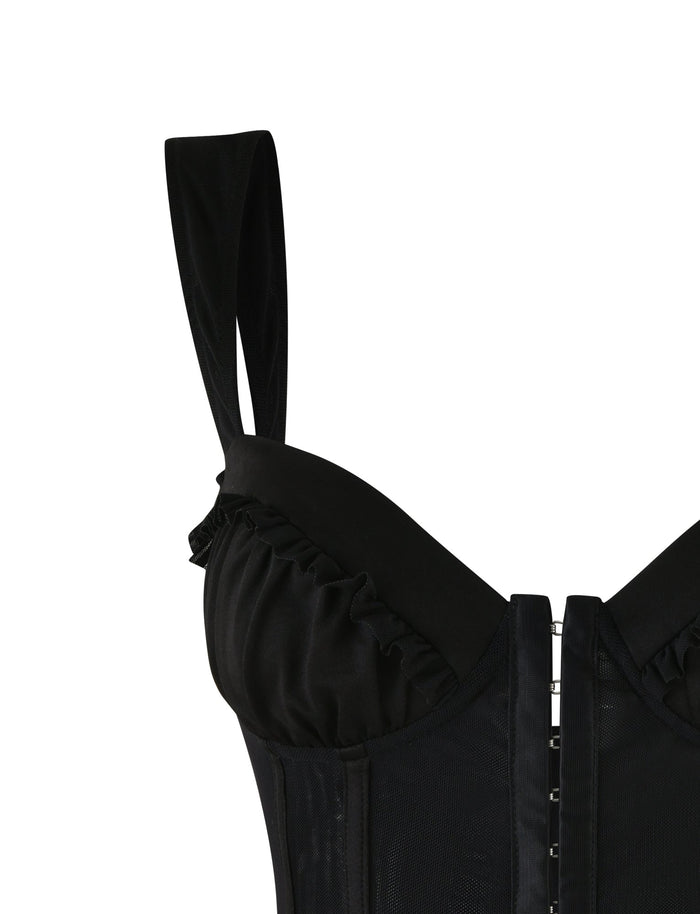 The GINNY TOP - BLACK by TIGERMIST is a sleeveless bustier that showcases elegant ruffled detailing along the sweetheart neckline and convenient hook-eye closures at the front. With wide straps enhancing its bodycon silhouette, this top blends opaque and sheer materials for a stylish finish.