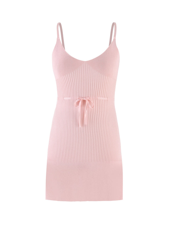 A dress from TIGERMIST, the GREER DRESS in Baby Pink, features true-tie shoulder straps and a front tie detail, beautifully showcased against a white backdrop.