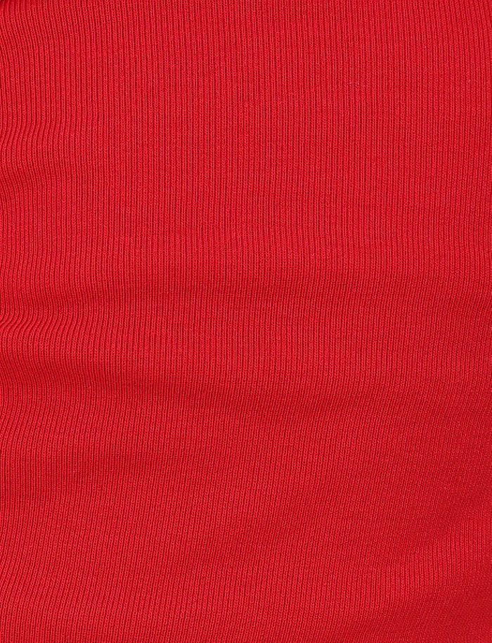 The HARRIETT RIB TUBE TOP by TIGERMIST features a close-up of its vibrant red ribbed jersey fabric, with texture that creates subtle horizontal lines, adding depth and detail to its surface.