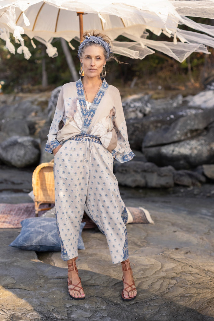 Model wearing Head in the Clouds Artist Pants featuring starry front panel and Turkish rug trim from Liotard’s portrait The Painter’s Wife-Market of Stars
