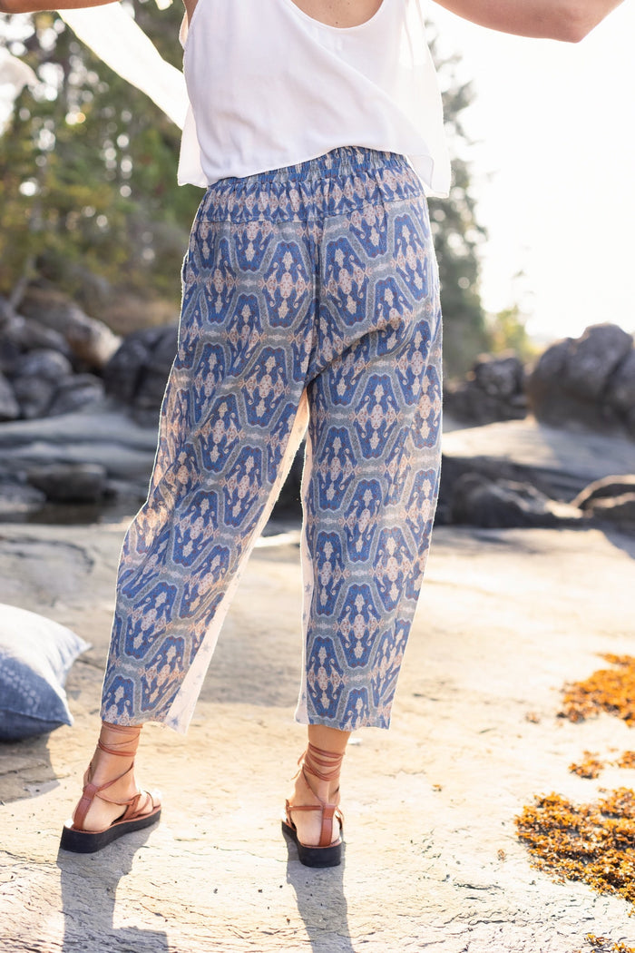 Model wearing Head in the Clouds Artist Pants featuring starry front panel and Turkish rug trim from Liotard’s portrait The Painter’s Wife-Market of Stars