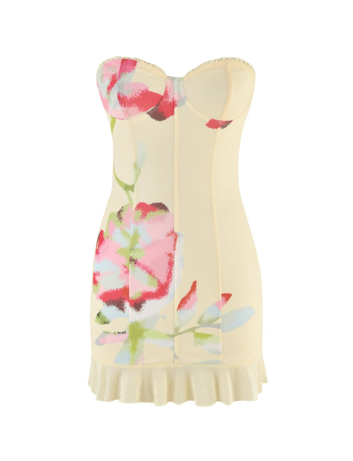 The HOLLIS DRESS by TIGERMIST is a strapless boob tube mini dress featuring a colorful, abstract floral design with vibrant red, pink, and green hues. The fitted bodice accentuates your figure, while a subtle ruffle along the hem adds playful elegance.