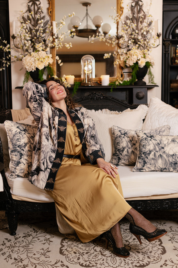 Model wearing a soft cotton velvet duster ft. 1900's floral lithographs. A garden dreamt up in ink - Market of Stars