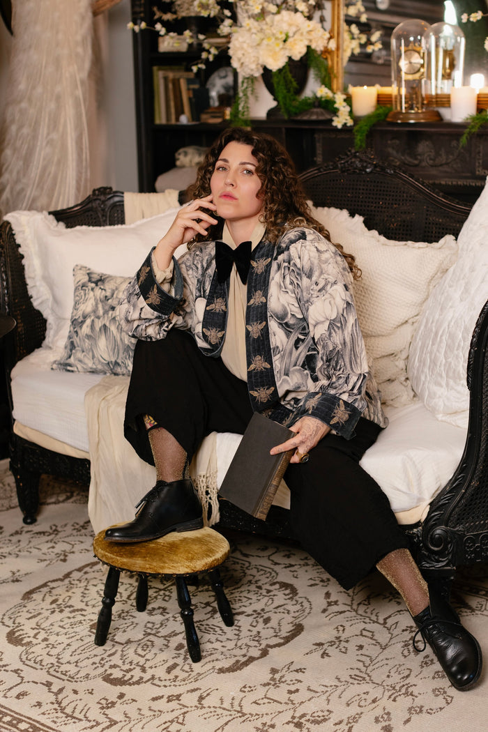 Model wearing a soft cotton velvet duster ft. 1900's floral lithographs. A garden dreamt up in ink - Market of Stars