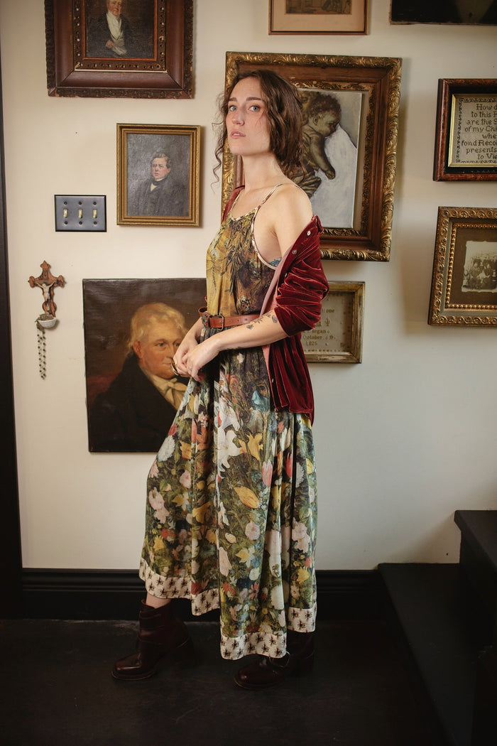 Model wearing the I Dream in Flowers Bohéme Slip Dress with vintage-inspired floral artwork and Victorian bumblebee details, perfect for layering or lounging – Market of Stars.