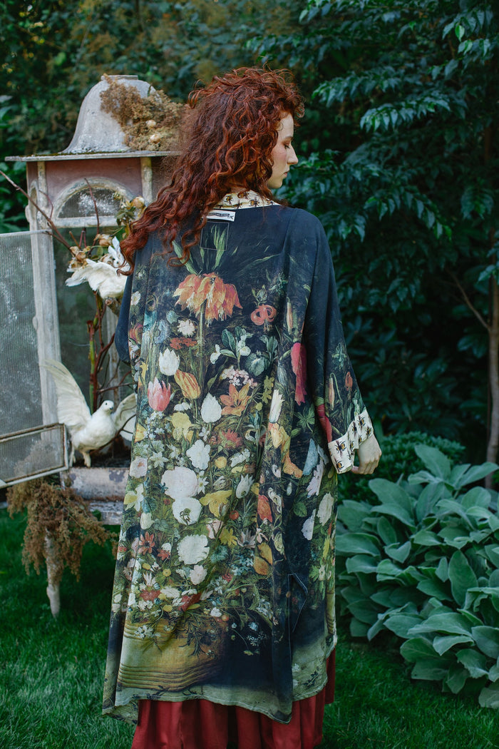 Model wearing the I Dream in Flowers Opera Duster featuring floral oil painting by Jan Brueghel and Victorian bumblebee trim – Market of Stars.
