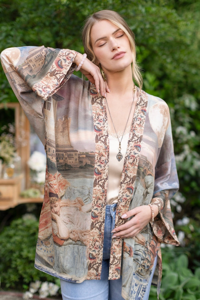 Model wearing the Imaginarium matinee duster featuring a dreamy collage of historic art, candle chandelier, and sleeping muse inspired by Victorian paintings – Market of Stars