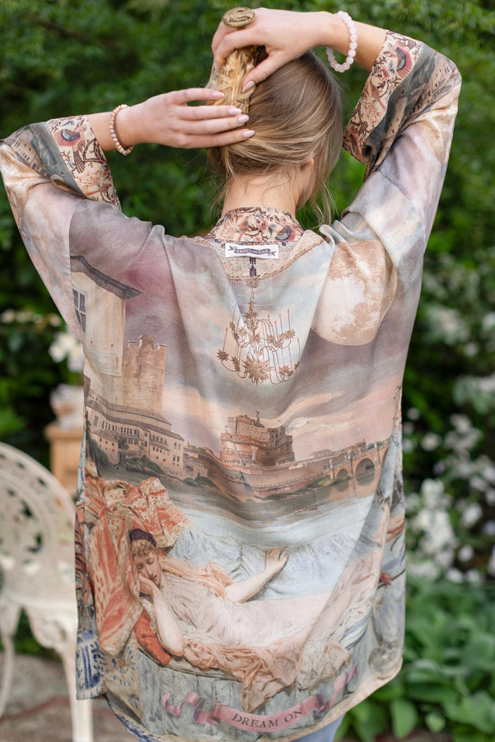 Model wearing the Imaginarium matinee duster featuring a dreamy collage of historic art, candle chandelier, and sleeping muse inspired by Victorian paintings – Market of Stars