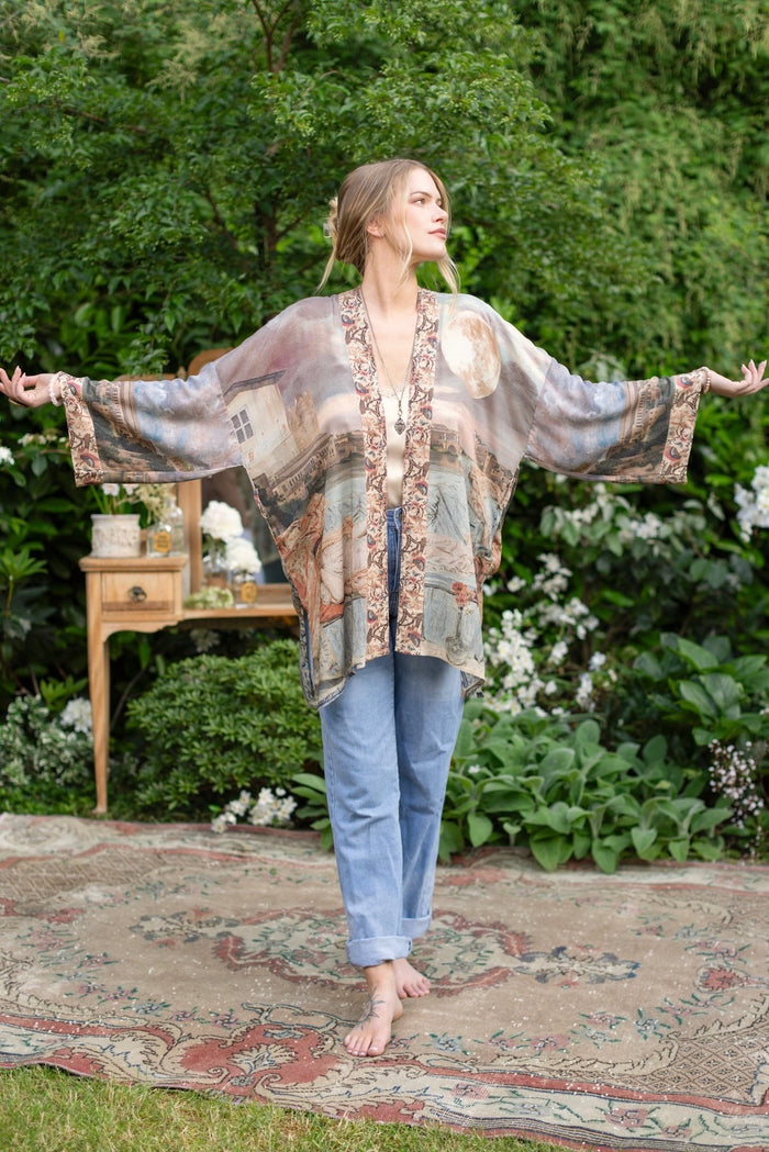 Model wearing the Imaginarium matinee duster featuring a dreamy collage of historic art, candle chandelier, and sleeping muse inspired by Victorian paintings – Market of Stars